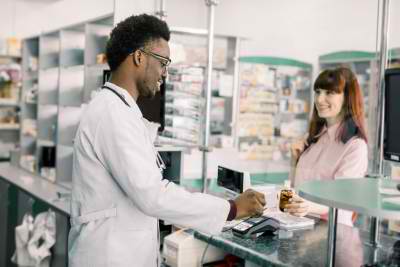 woman talking to the pharmacist
